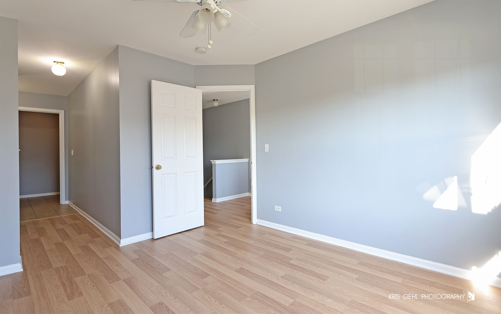 3141 Falling Waters Lane, Unit 3141 Lindenhurst, IL 60046 - Photo 12 of 17 wooden floor in an empty room with a window