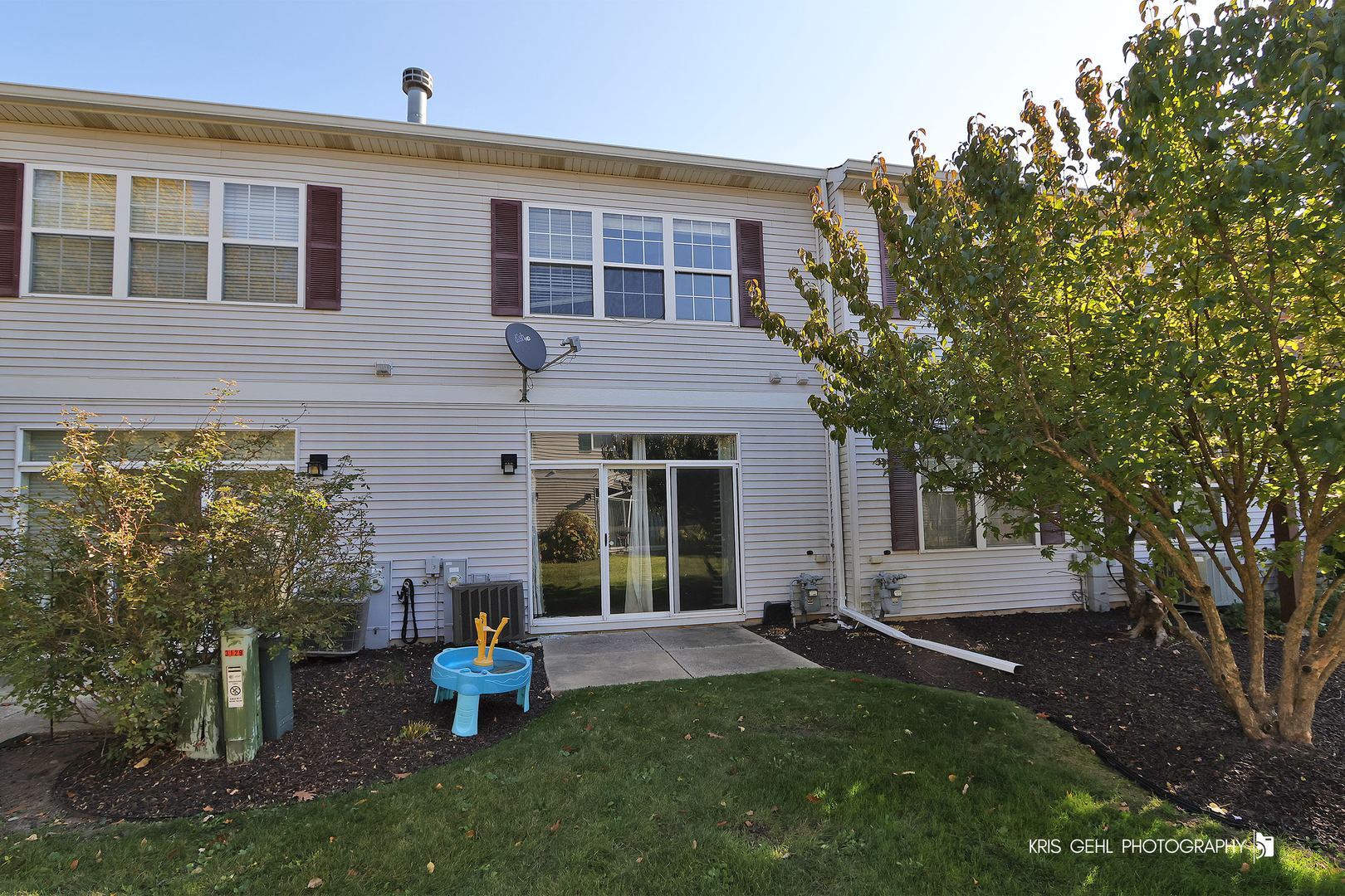 3141 Falling Waters Lane, Unit 3141 Lindenhurst, IL 60046 - Photo 16 of 17 a front view of a house with garden