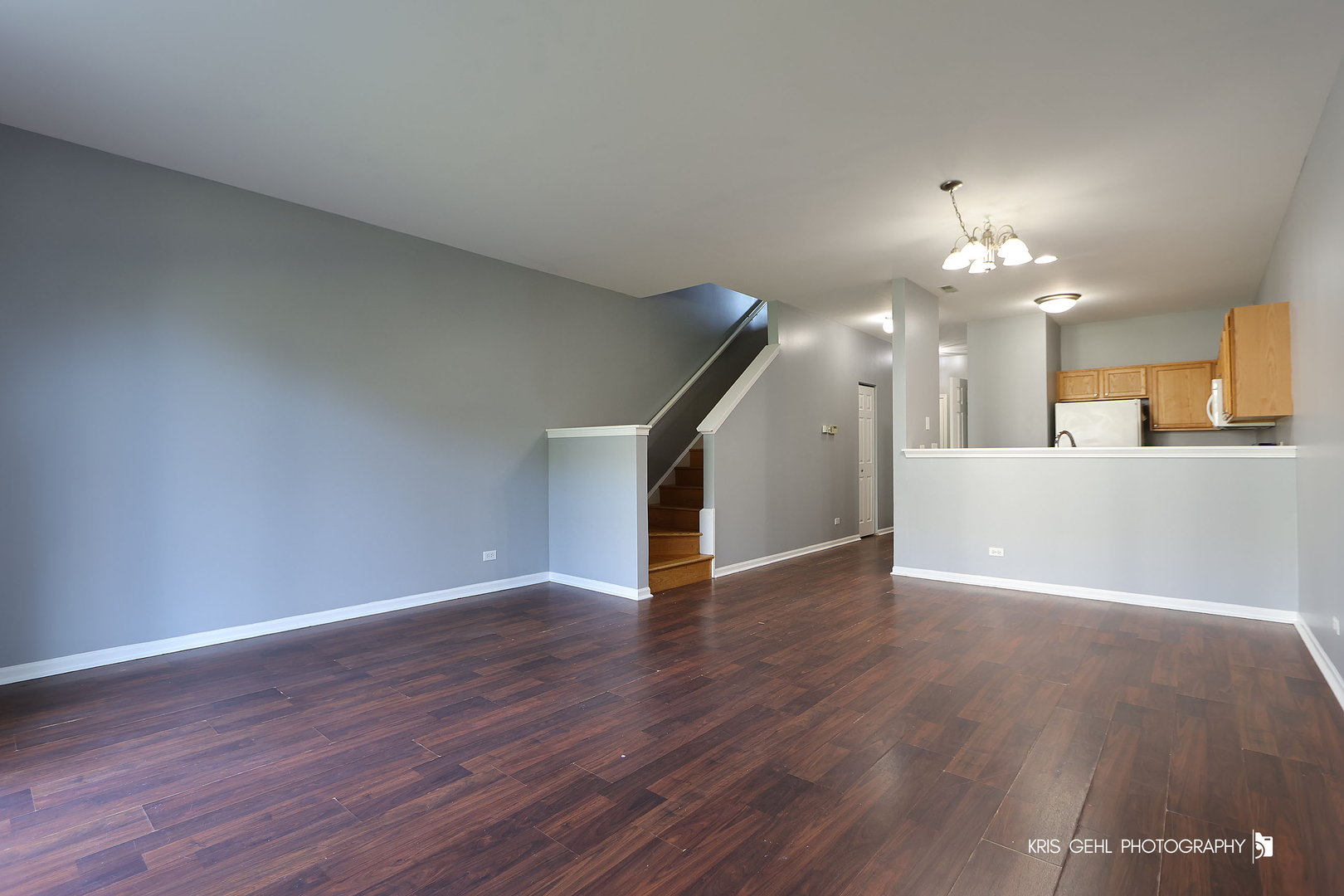 3141 Falling Waters Lane, Unit 3141 Lindenhurst, IL 60046 - Photo 2 of 17 a view of a kitchen with wooden floor and a kitchen