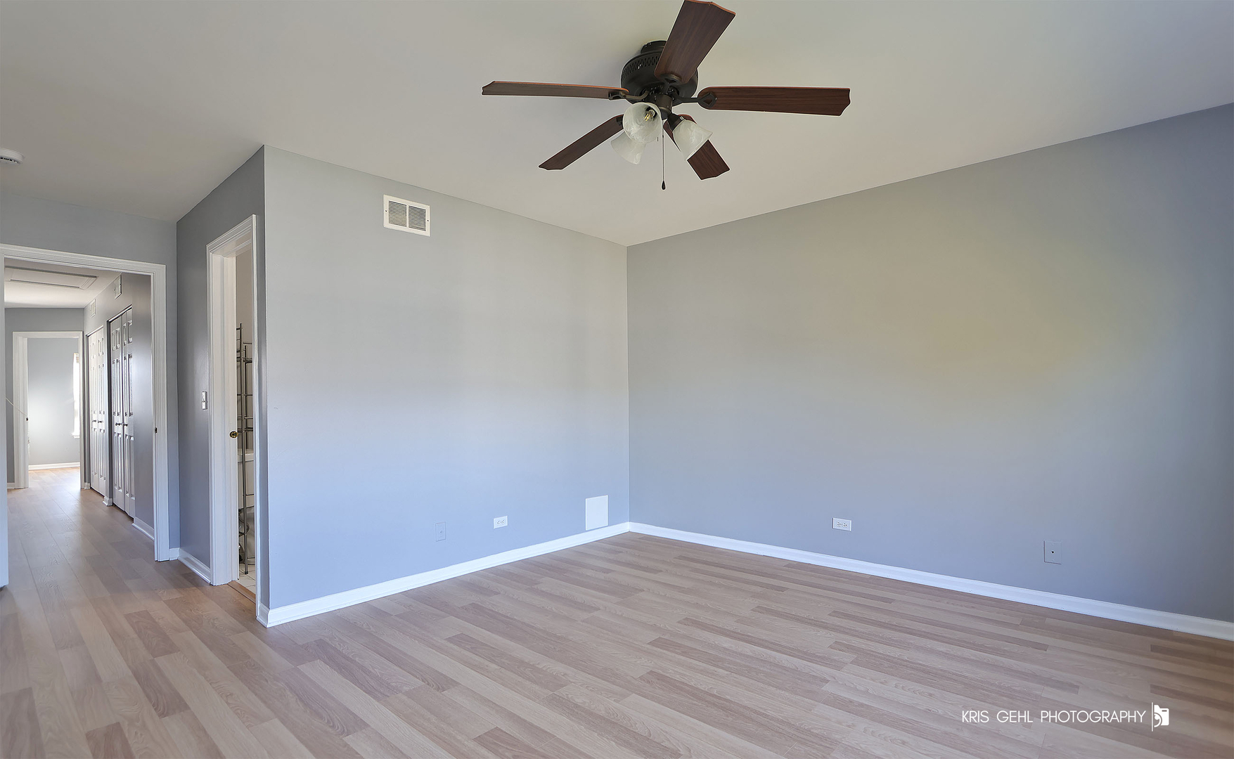 3141 Falling Waters Lane, Unit 3141 Lindenhurst, IL 60046 - Photo 8 of 17 a view of an empty room with wooden floor