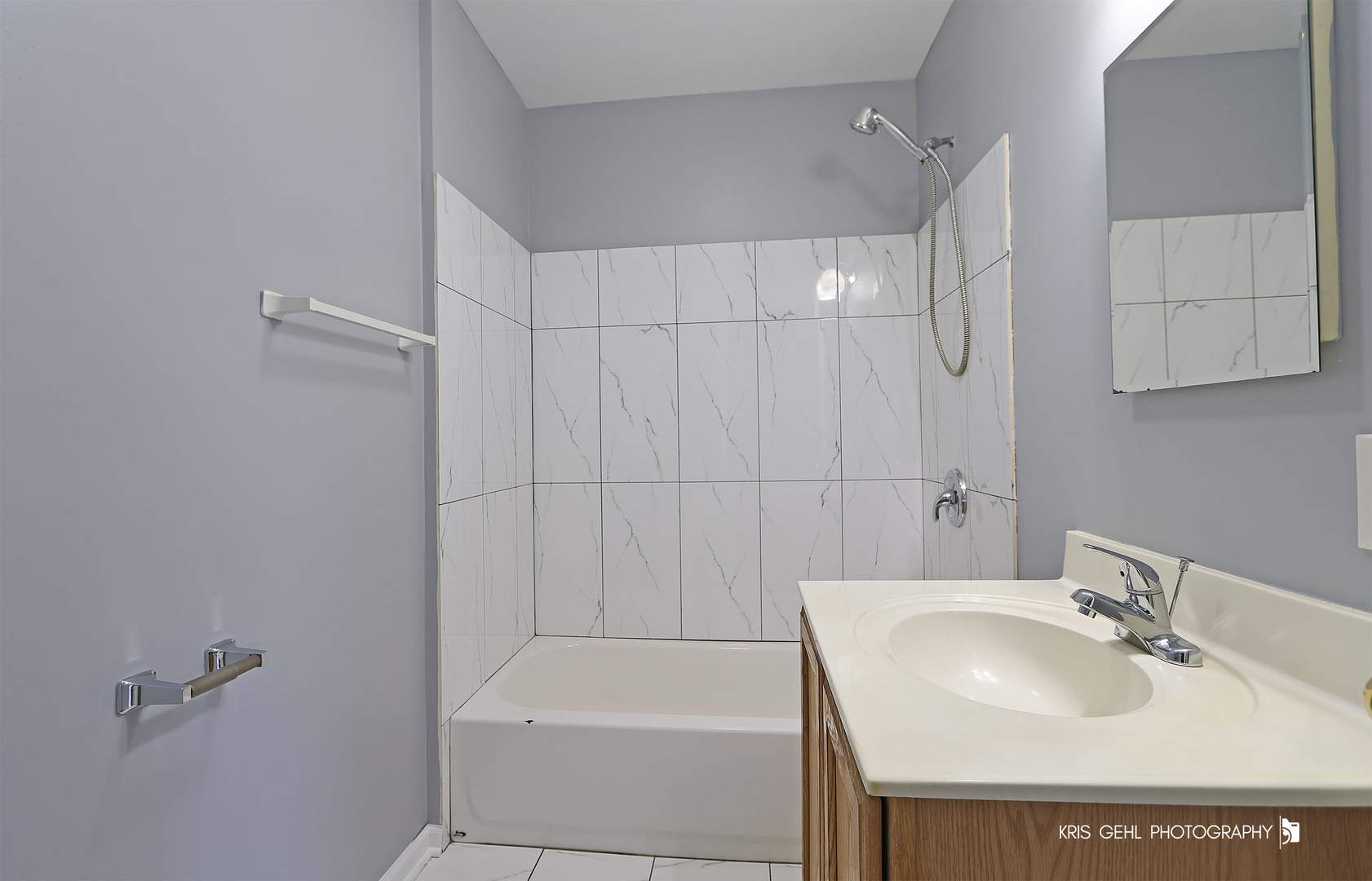 3141 Falling Waters Lane, Unit 3141 Lindenhurst, IL 60046 - Photo 10 of 17 a bathroom with a sink a toilet and tub