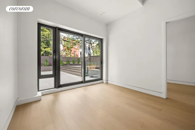 a kitchen with white cabinets and a stove