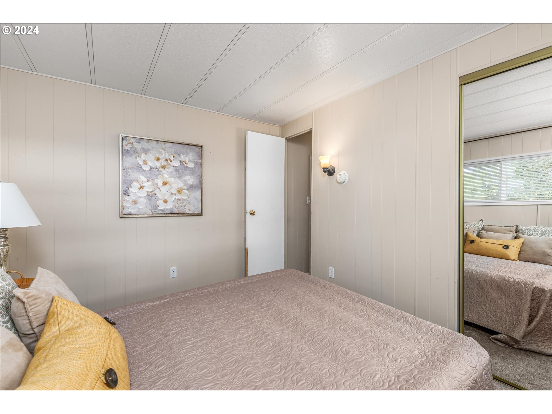 2150 Laura Street, Unit 90 Springfield, OR 97477 - Photo 16 of 18 a bedroom with a bed and a couch