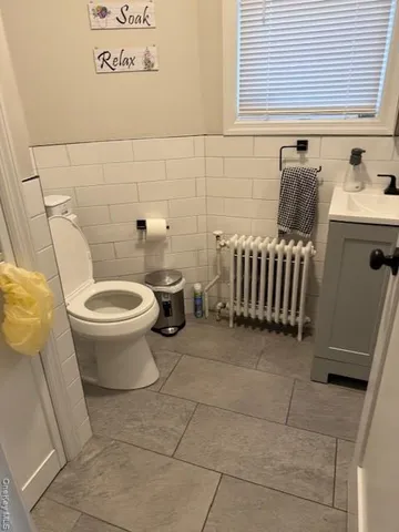a bathroom with a toilet and a sink