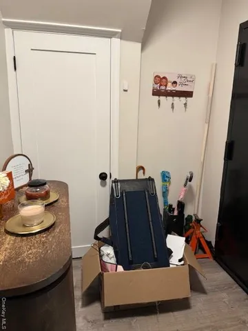 a living room with furniture and a mirror