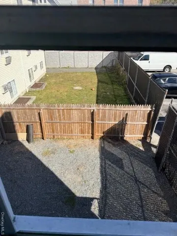 a view of swimming pool with wooden floor