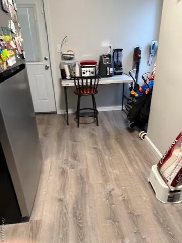 a view of a workspace with furniture