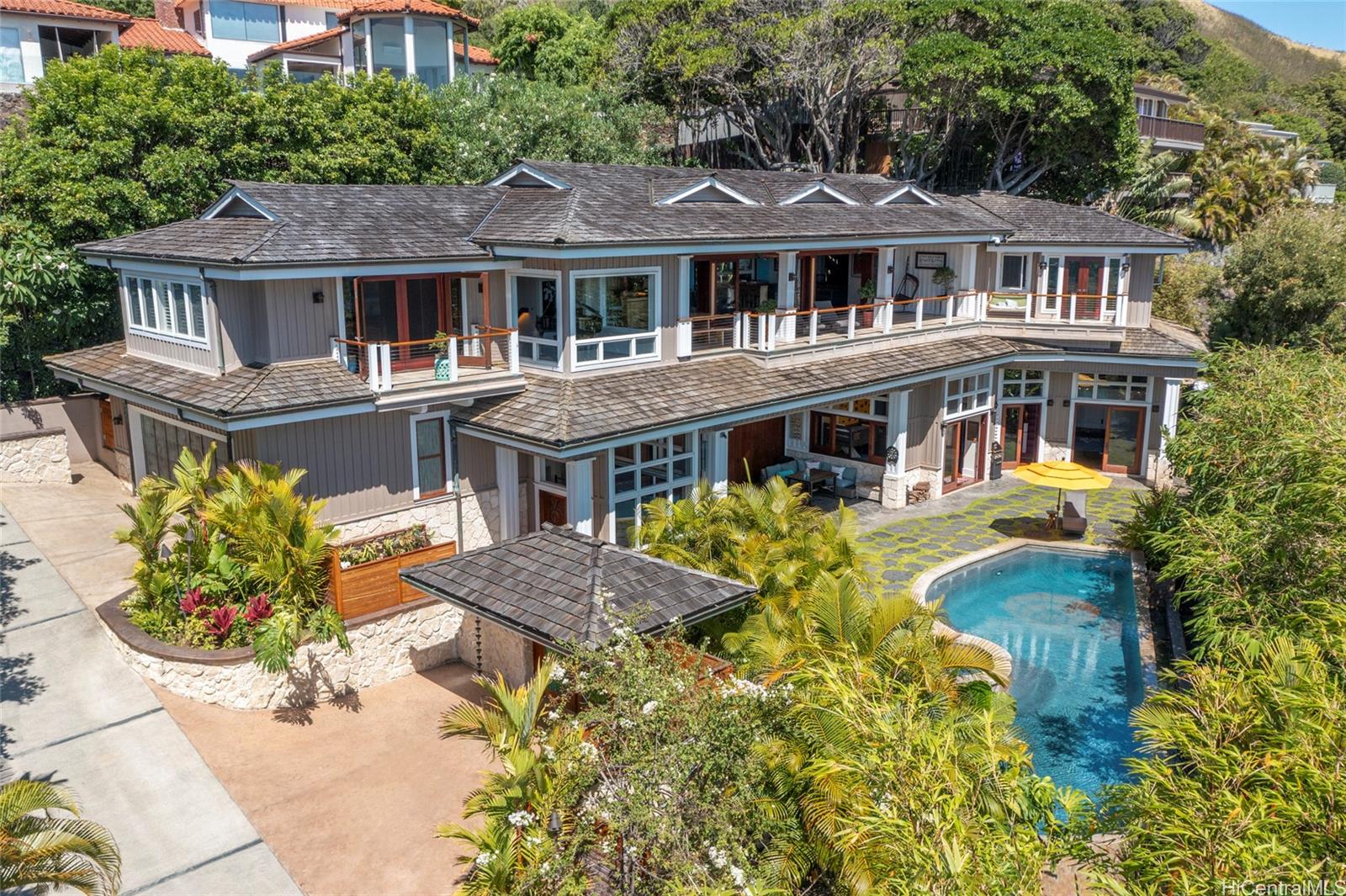 1037 Koohoo Place Kailua, HI 96734 - Photo 1 of 1 a front view of a house with a yard and fountain