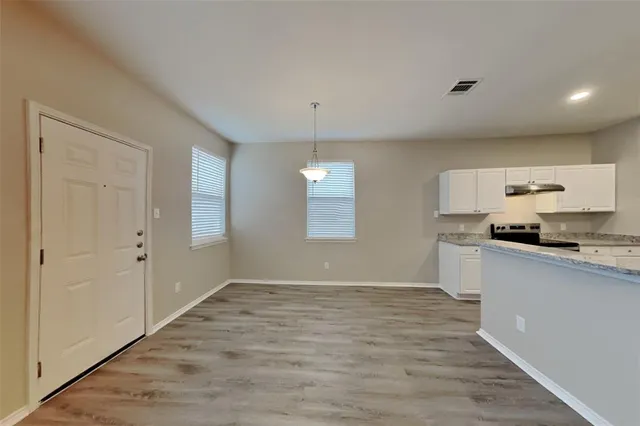 a view of a kitchen from the hallway