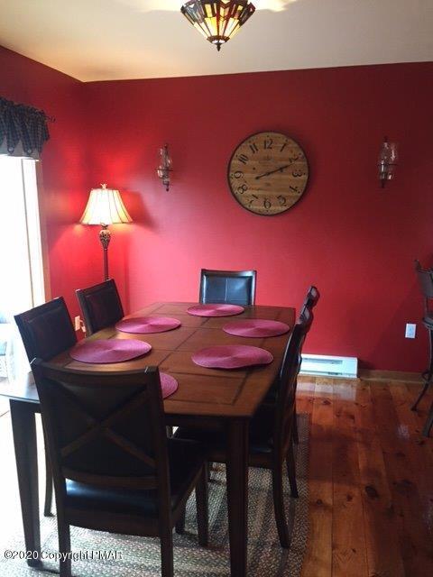 557 Upper Deer Valley Road Tannersville, PA 18372 - Photo 10 of 41 a dining room with a table and chairs