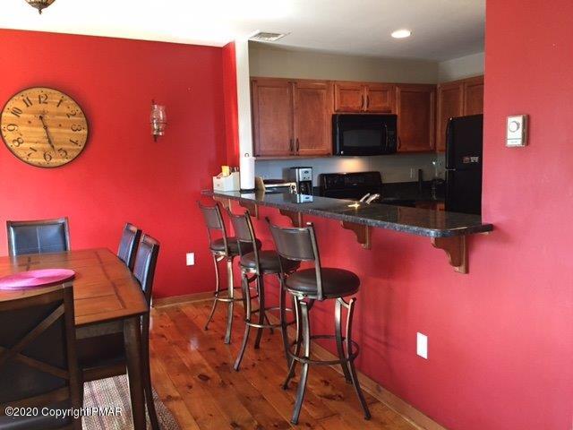 557 Upper Deer Valley Road Tannersville, PA 18372 - Photo 11 of 41 a view of a dining room with furniture