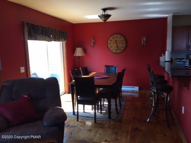557 Upper Deer Valley Road Tannersville, PA 18372 - Photo 14 of 41 a view of a dining room with furniture and chandelier