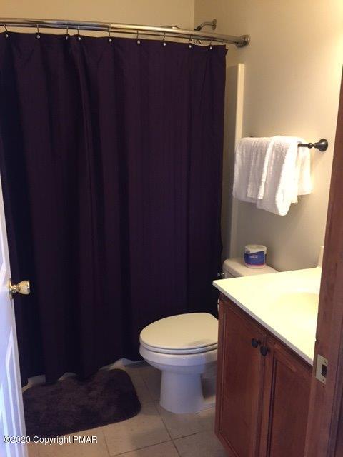 557 Upper Deer Valley Road Tannersville, PA 18372 - Photo 20 of 41 a bathroom with a toilet and a shower