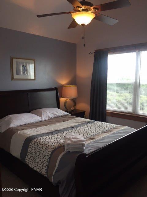 557 Upper Deer Valley Road Tannersville, PA 18372 - Photo 28 of 41 a bedroom with a bed and window