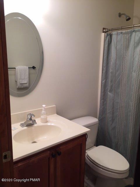 557 Upper Deer Valley Road Tannersville, PA 18372 - Photo 29 of 41 a bathroom with a sink a toilet and mirror