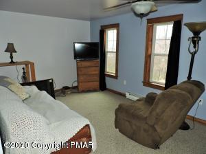 557 Upper Deer Valley Road Tannersville, PA 18372 - Photo 35 of 41 a living room with furniture and a window