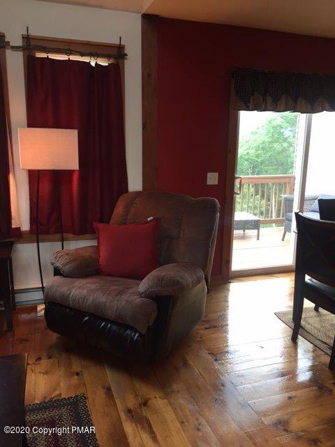557 Upper Deer Valley Road Tannersville, PA 18372 - Photo 41 of 41 a living room with furniture and a window