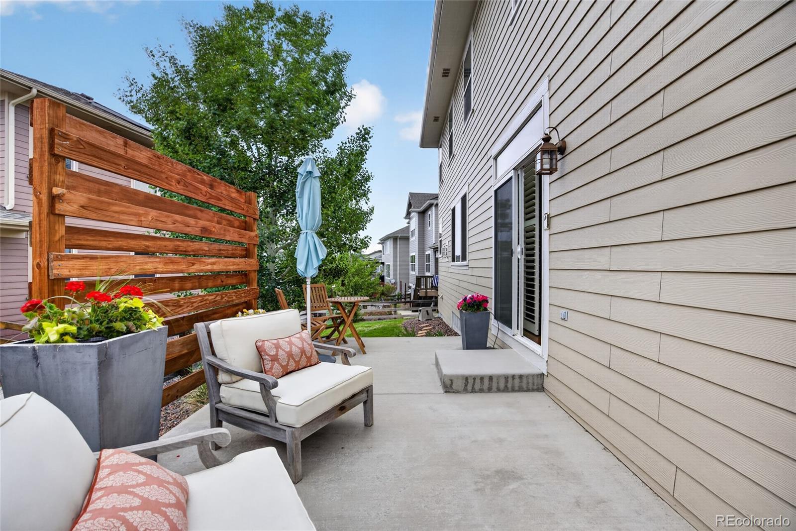 20554 East Shady Ridge Road Parker, CO 80134 - Photo 43 of 49 a view of a patio with couches and potted plants