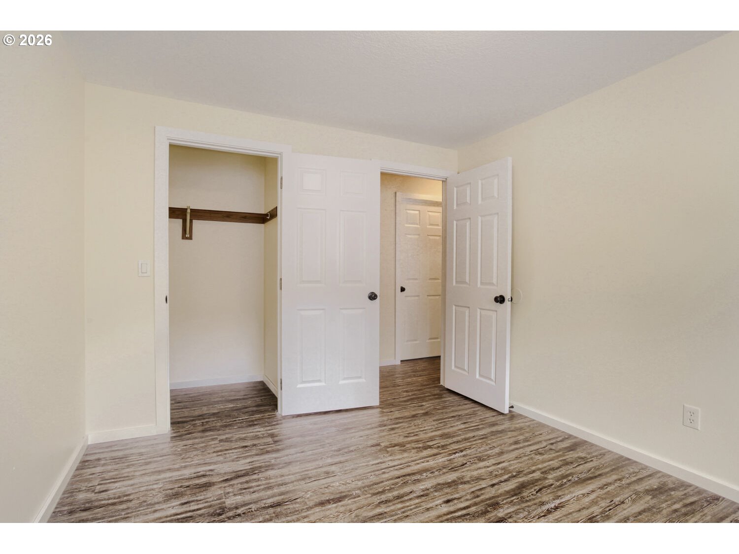 14539 Southeast Center Street Portland, OR 97236 - Photo 19 of 30 a view of an empty room with wooden floor
