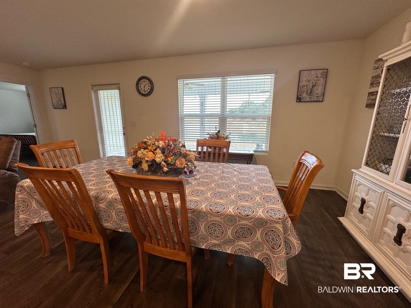 23792 Unbridled Loop Daphne, AL 36526 - Photo 11 of 36 Dining room featuring dark wood-style floors and baseboards