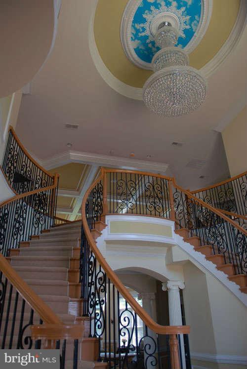 6608 Edsall Road Springfield, VA 22151 - Photo 10 of 29 a view of staircase with railing and white walls