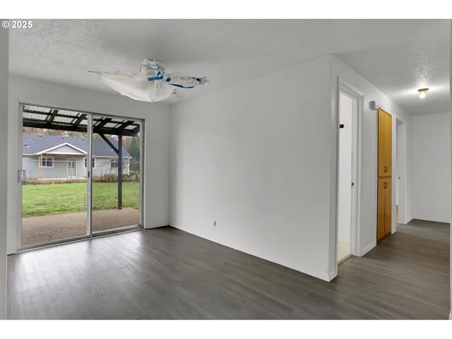 a view of an entryway with wooden floor