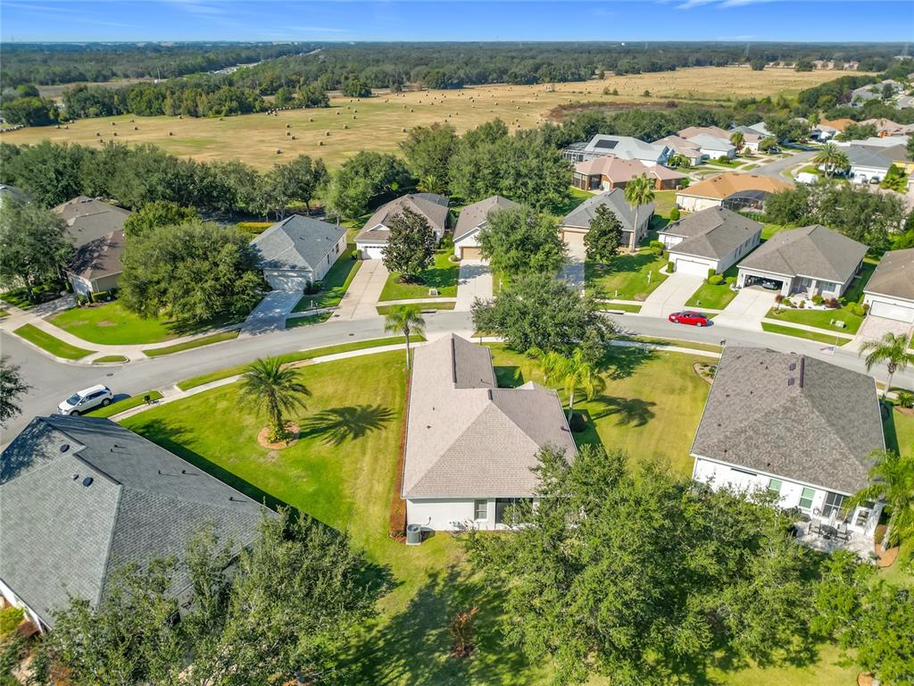 3529 Mt Hope Loop Leesburg, FL 34748 - Photo 49 of 86 an aerial view of a house with a swimming pool