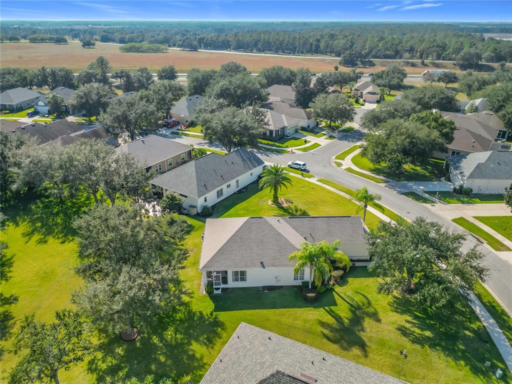 3529 Mt Hope Loop Leesburg, FL 34748 - Photo 51 of 86 an aerial view of residential houses with outdoor space and swimming pool