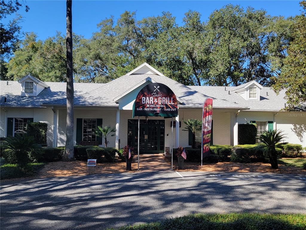3529 Mt Hope Loop Leesburg, FL 34748 - Photo 59 of 86 a front view of a house with a porch