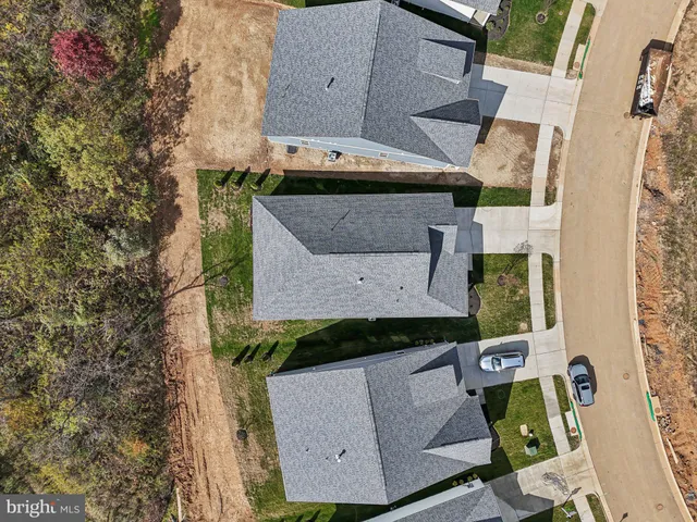 a front view of house with backyard