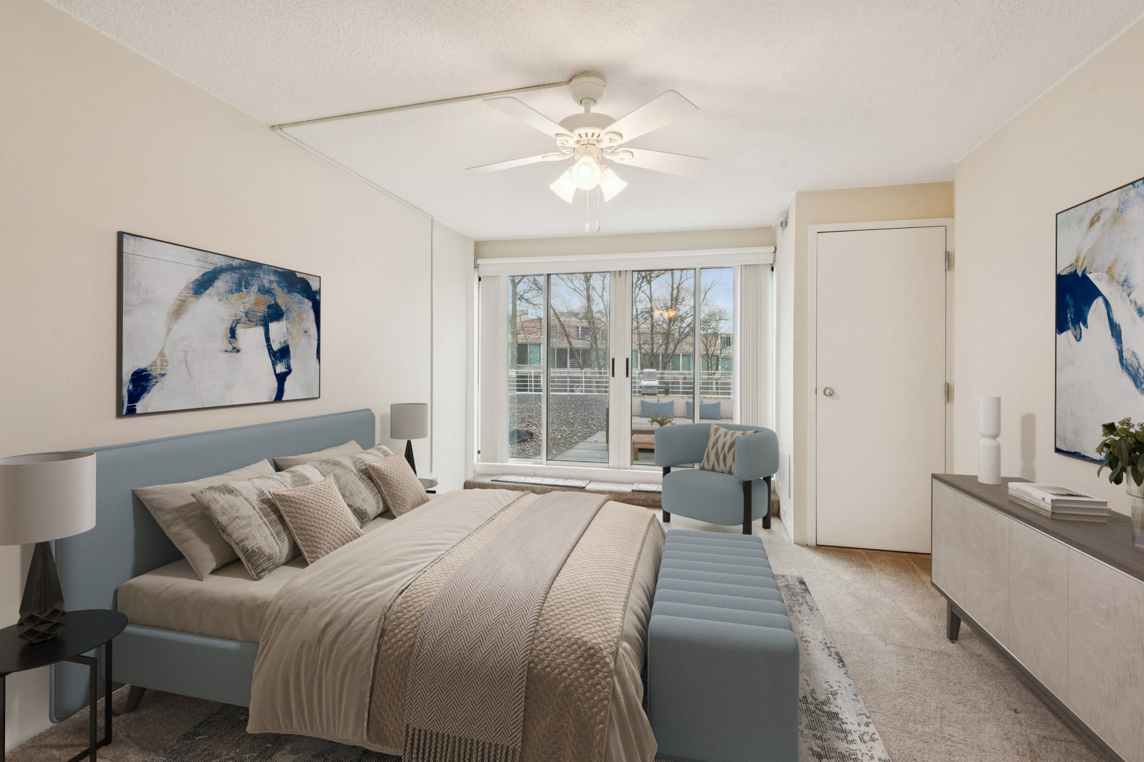 2555 Gross Point Road, Unit 101 Evanston, IL 60201 - Photo 9 of 23 a bedroom with a large bed and a chandelier