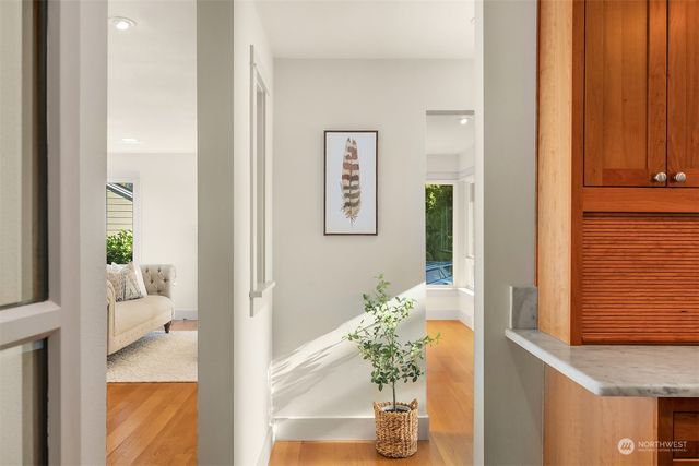 a kitchen with granite countertop a sink stove and refrigerator