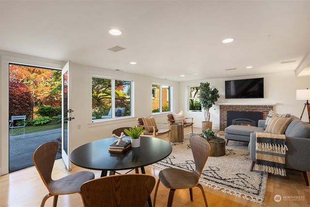 a living room with furniture a rug and a window
