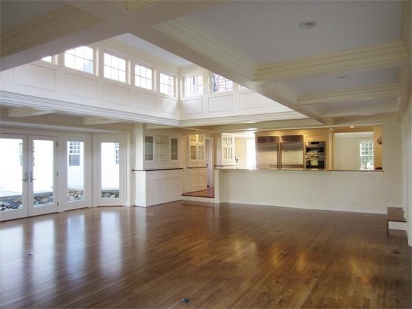 45 Old Farm Road Wellesley, MA 02481 - Photo 5 of 20 a view of an empty room with wooden floor and a window