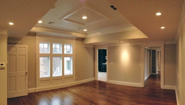 45 Old Farm Road Wellesley, MA 02481 - Photo 9 of 20 a view of an empty room with wooden floor and a window