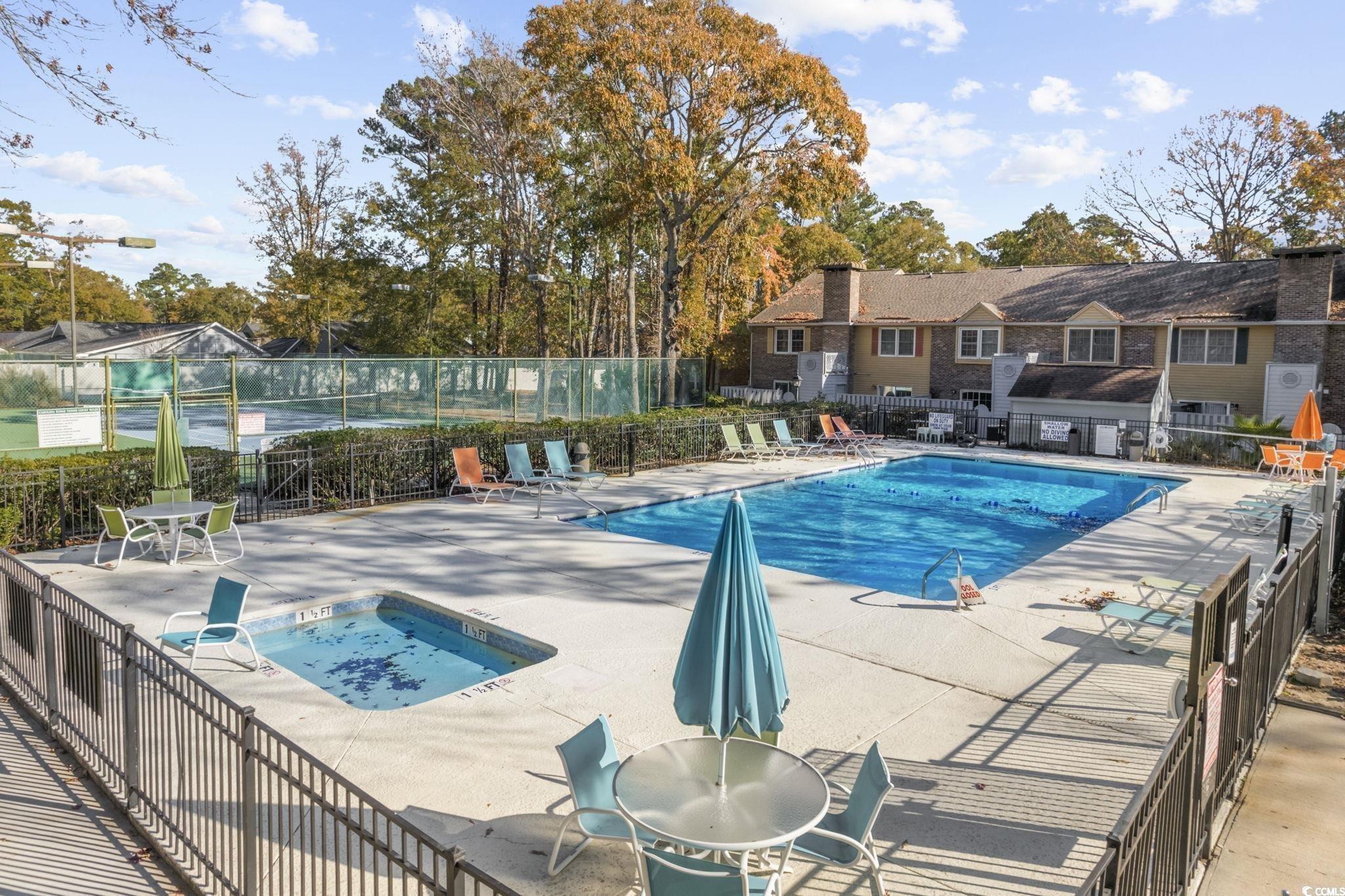 830 44th Avenue North, Unit B4 Myrtle Beach, SC 29577 - Photo 13 of 13 Community pool with a patio and a community hot tub