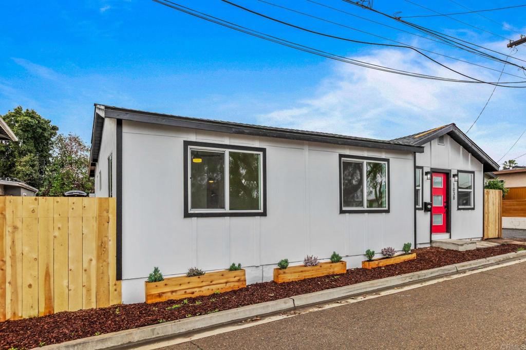 1038 Delaware Street Imperial Beach, CA 91932 - Photo 6 of 37 a front view of a house with yard