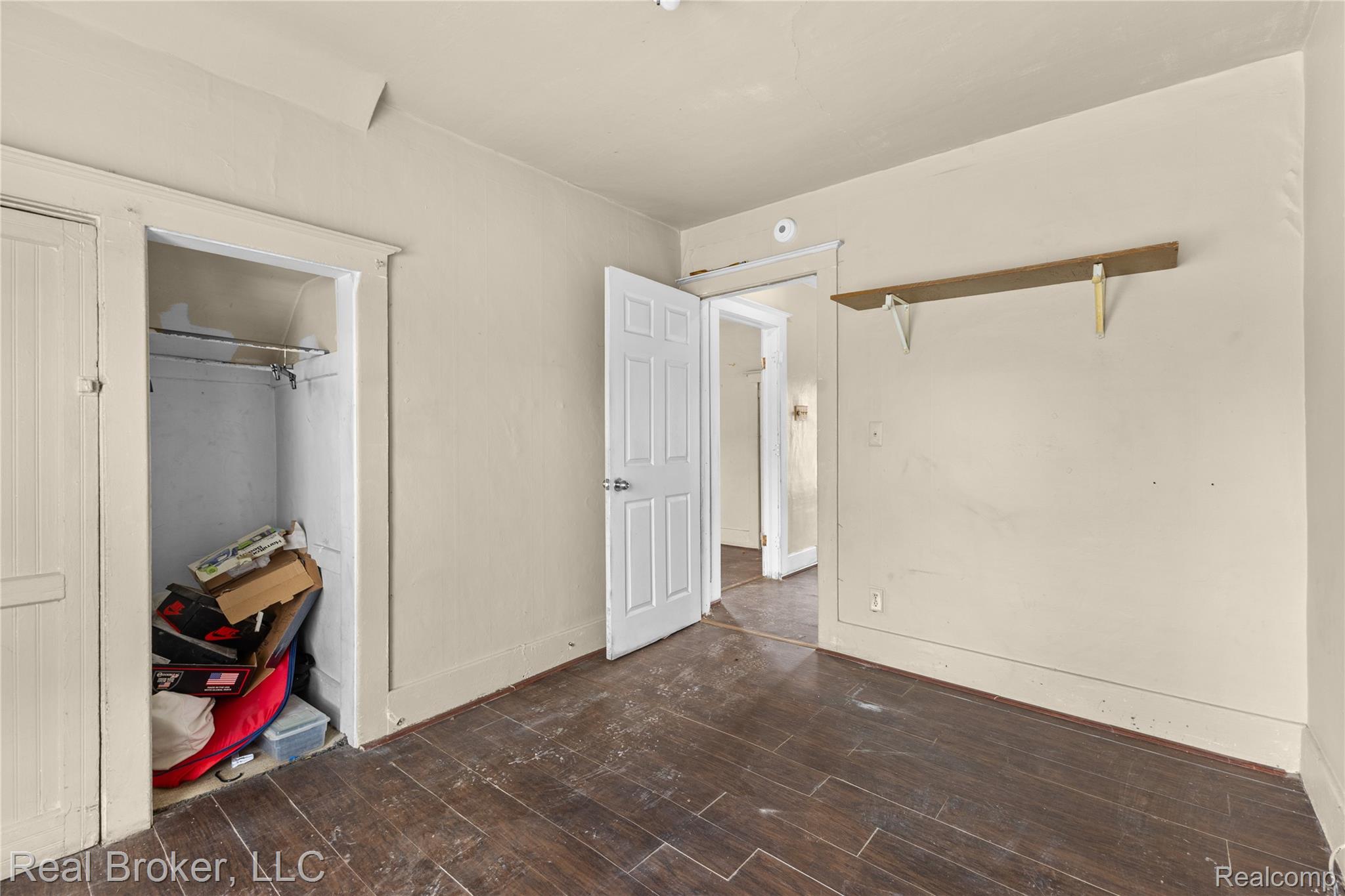 352 Perry Street Pontiac, MI 48342 - Photo 19 of 30 Unfurnished bedroom with a closet and dark wood-style floors