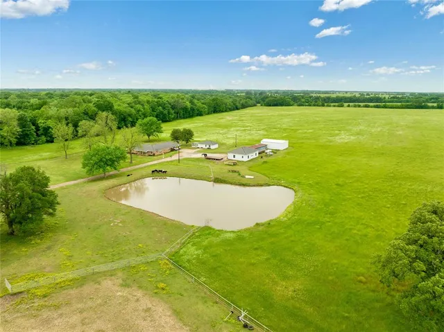 a view of a lake and a yard