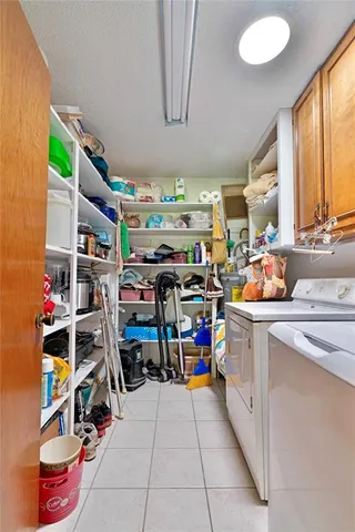a storage room with washer and dryer