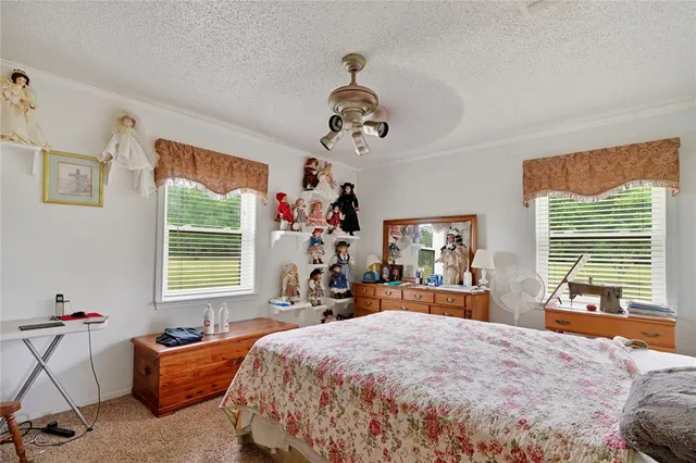 a bed room with a bed and a chandelier