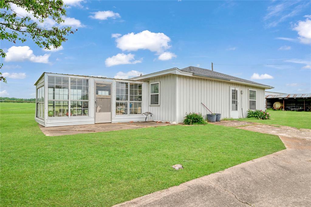 1355 County Road 33100 Sumner, TX 75486 - Photo 33 of 34 a view of a house with backyard and porch