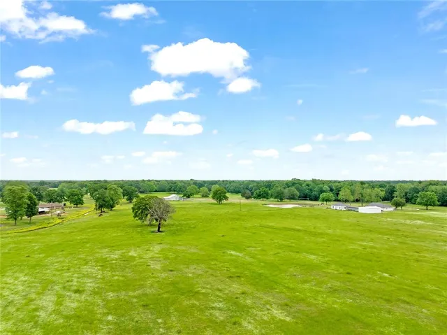 a view of a lake with houses in the background