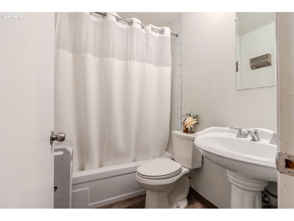 200 Southwest Florence Avenue, Unit D15 Gresham, OR 97080 - Photo 12 of 29 a bathroom with a sink a toilet and shower