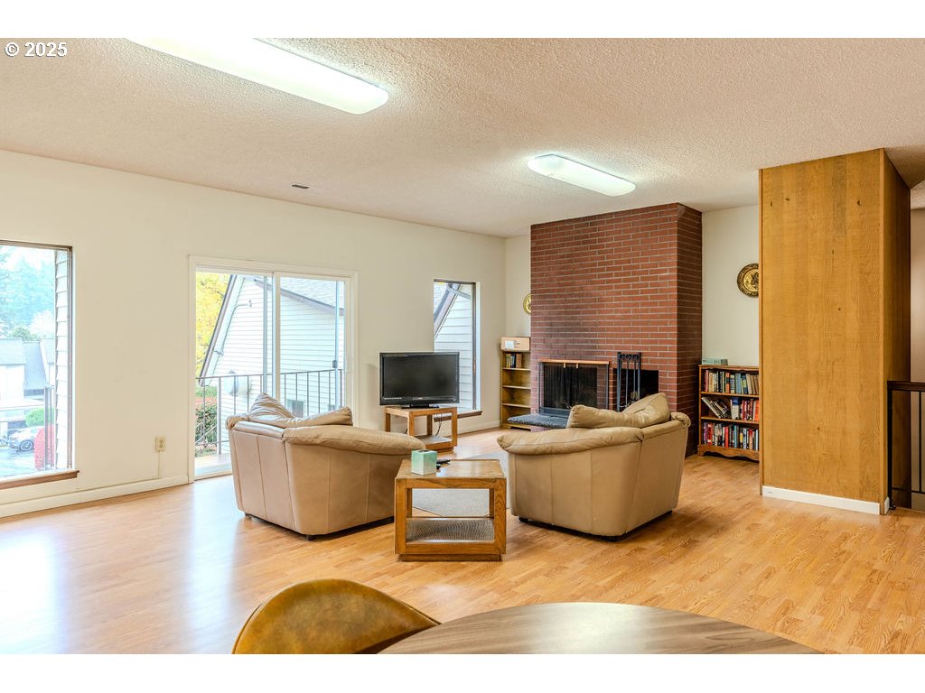200 Southwest Florence Avenue, Unit D15 Gresham, OR 97080 - Photo 21 of 29 a living room with furniture and a flat screen tv