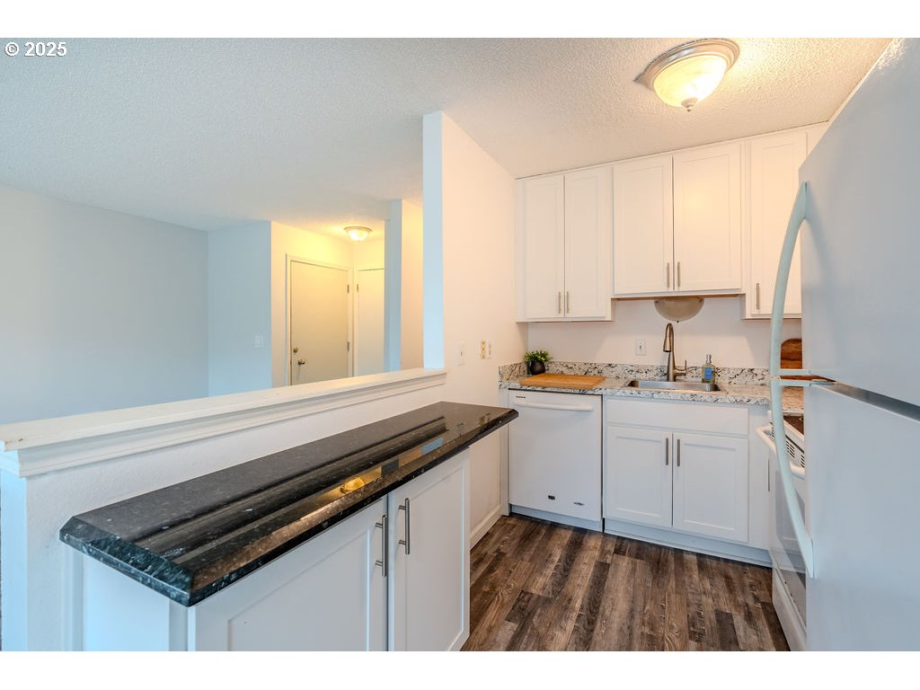 200 Southwest Florence Avenue, Unit D15 Gresham, OR 97080 - Photo 8 of 29 a kitchen with a sink appliances cabinets and a window