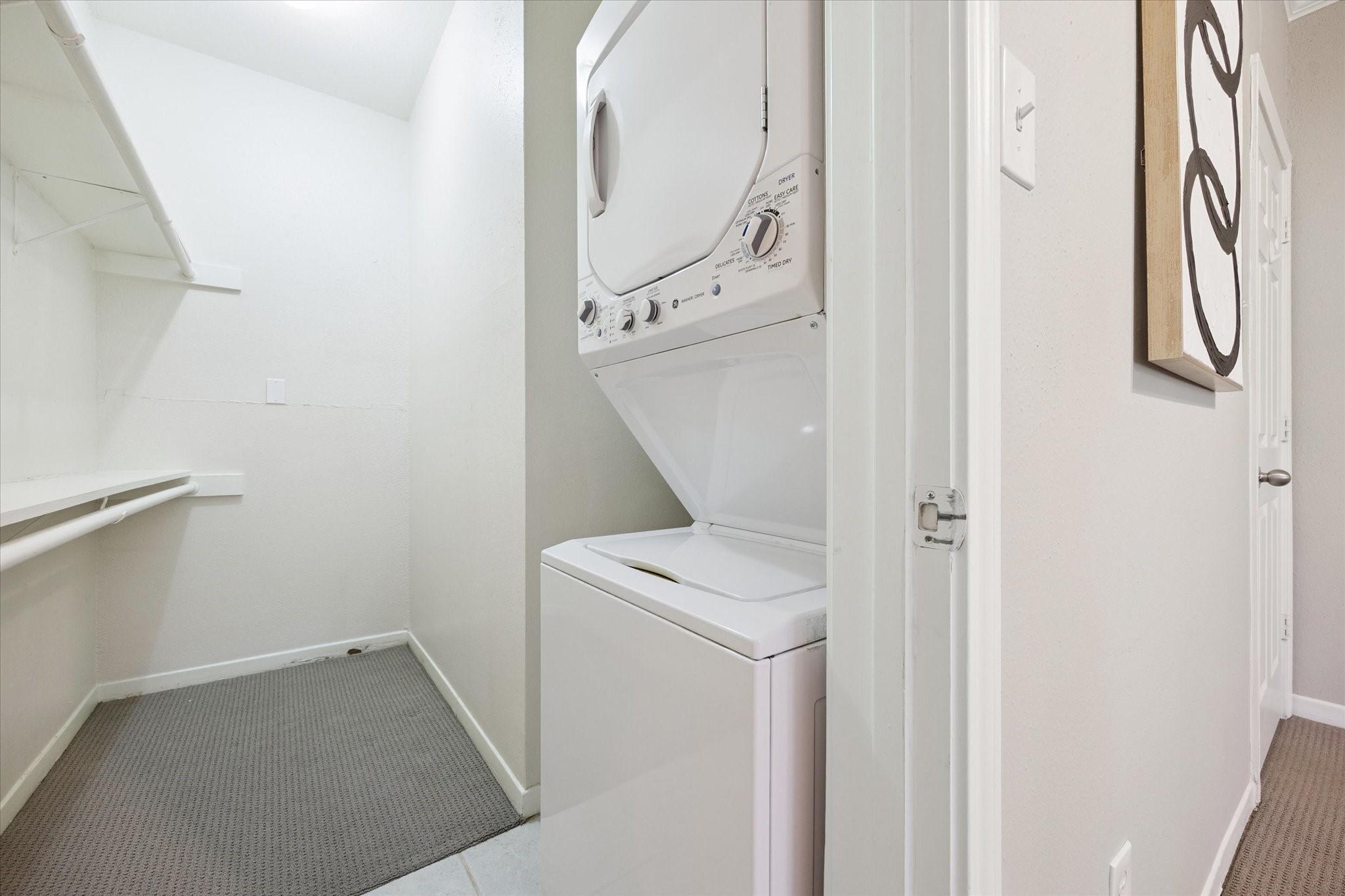 4041 Drake Street, Unit 113 Houston, TX 77005 - Photo 12 of 15 Large walk in closet with stackable washer and dryer.