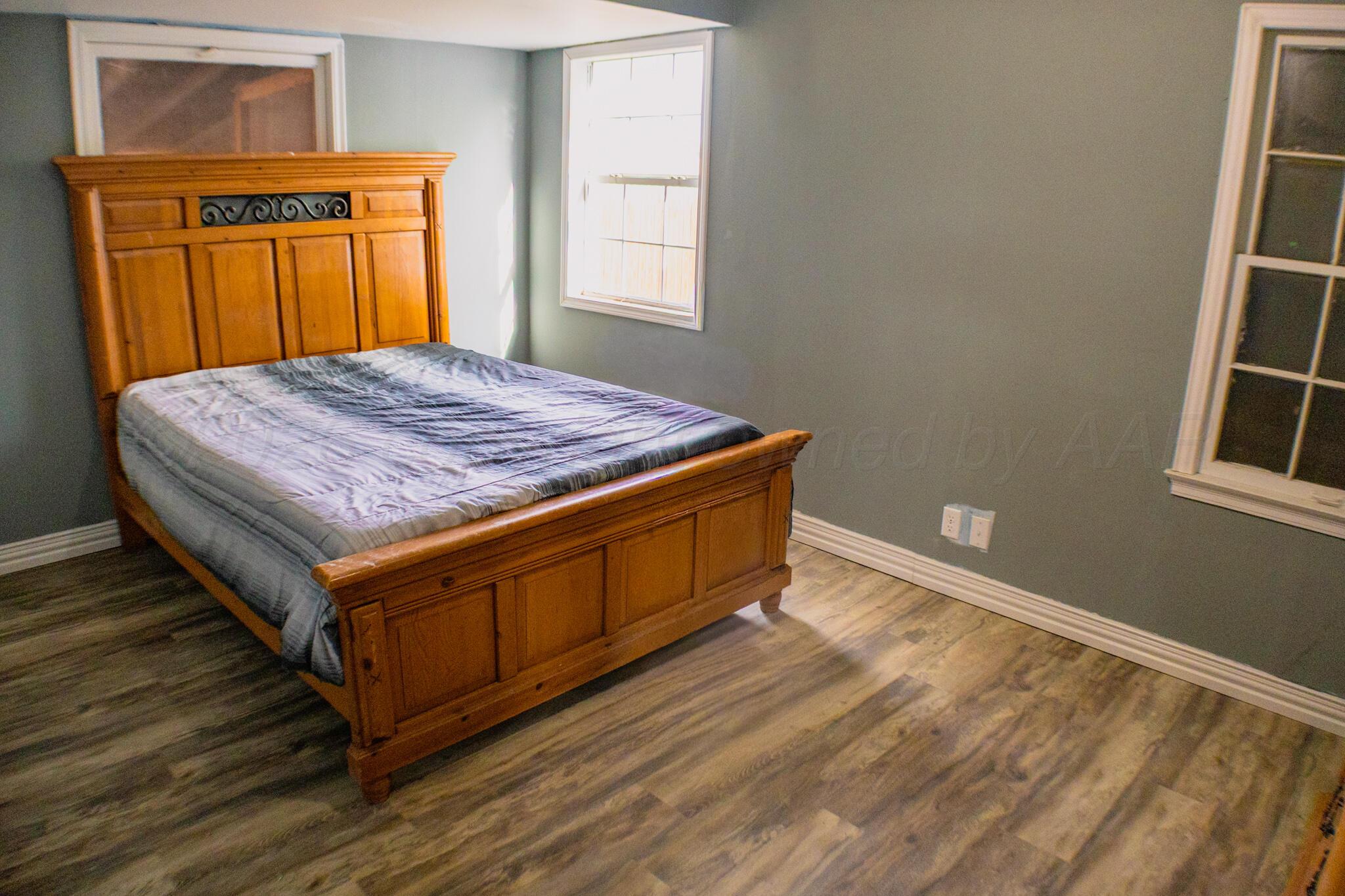 211 Butadieno Street Borger, TX 79007 - Photo 14 of 26 a bedroom with a bed and dresser
