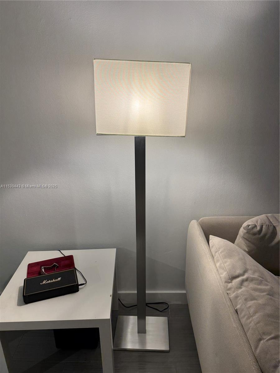 1200 West Avenue, Unit 202 Miami Beach, FL 33139 - Photo 19 of 45 a living room with furniture and a lamp