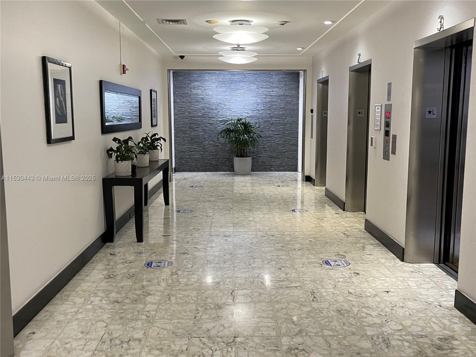 1200 West Avenue, Unit 202 Miami Beach, FL 33139 - Photo 29 of 45 a view of a hallway with living room